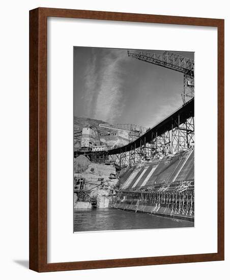 The Grand Coulee Dam under Construction with a Sign in the Bkgrd. That Says: "Safety Pays"-Alfred Eisenstaedt-Framed Photographic Print