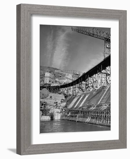 The Grand Coulee Dam under Construction with a Sign in the Bkgrd. That Says: "Safety Pays"-Alfred Eisenstaedt-Framed Photographic Print