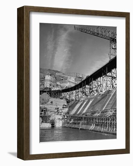 The Grand Coulee Dam under Construction with a Sign in the Bkgrd. That Says: "Safety Pays"-Alfred Eisenstaedt-Framed Photographic Print