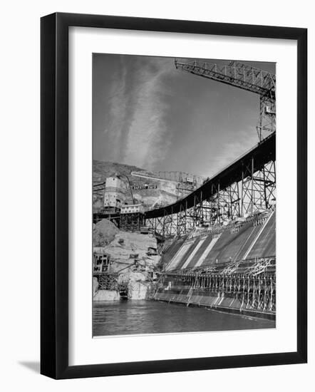 The Grand Coulee Dam under Construction with a Sign in the Bkgrd. That Says: "Safety Pays"-Alfred Eisenstaedt-Framed Photographic Print