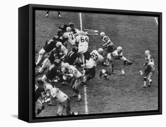 The Green Bay Packers Playing a Game-George Silk-Framed Premier Image Canvas