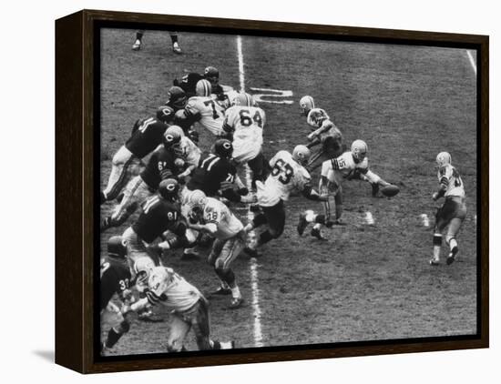 The Green Bay Packers Playing a Game-George Silk-Framed Premier Image Canvas