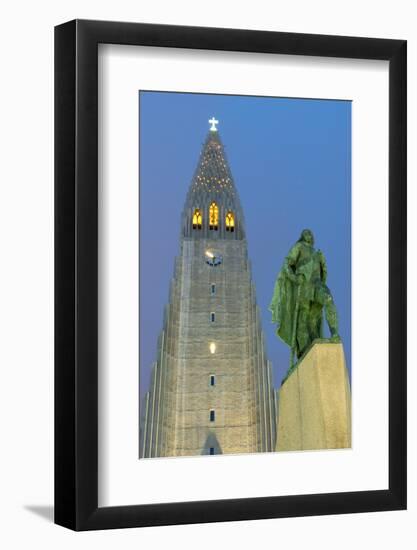 The Hallgrims Church with a statue of Leif Erikson in the foreground lit up at night, Reykjavik, Ic-Miles Ertman-Framed Photographic Print