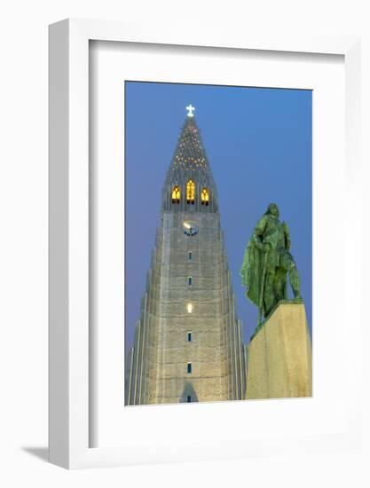 The Hallgrims Church with a statue of Leif Erikson in the foreground lit up at night, Reykjavik, Ic-Miles Ertman-Framed Photographic Print