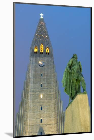 The Hallgrims Church with a statue of Leif Erikson in the foreground lit up at night, Reykjavik, Ic-Miles Ertman-Mounted Photographic Print