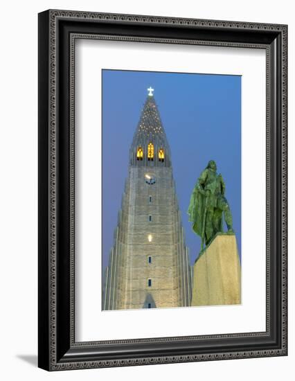 The Hallgrims Church with a statue of Leif Erikson in the foreground lit up at night, Reykjavik, Ic-Miles Ertman-Framed Photographic Print