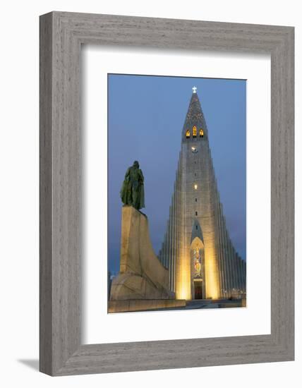 The Hallgrims Church with a statue of Leif Erikson in the foreground lit up at night, Reykjavik, Ic-Miles Ertman-Framed Photographic Print