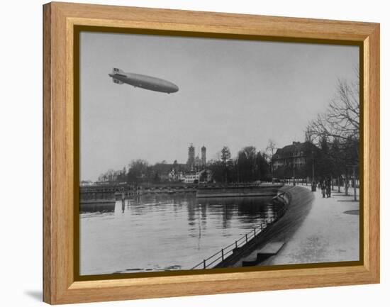 The Hindenburg Airship of Zeppelin Design Flying over City Where it was Fabricated-null-Framed Premier Image Canvas