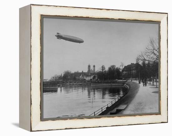 The Hindenburg Airship of Zeppelin Design Flying over City Where it was Fabricated-null-Framed Premier Image Canvas