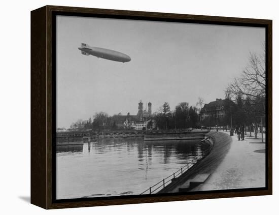 The Hindenburg Airship of Zeppelin Design Flying over City Where it was Fabricated-null-Framed Premier Image Canvas