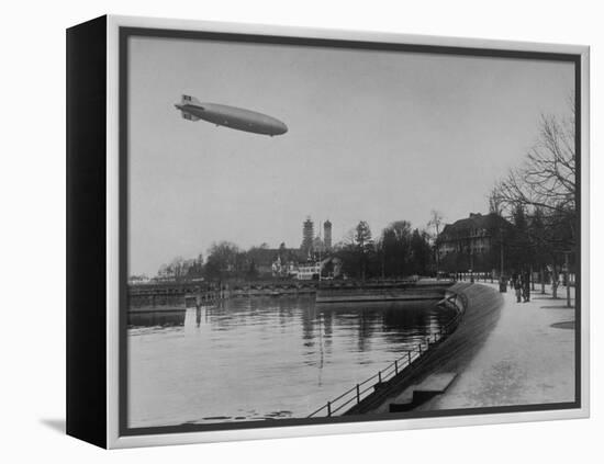 The Hindenburg Airship of Zeppelin Design Flying over City Where it was Fabricated-null-Framed Premier Image Canvas