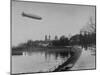 The Hindenburg Airship of Zeppelin Design Flying over City Where it was Fabricated-null-Mounted Photographic Print