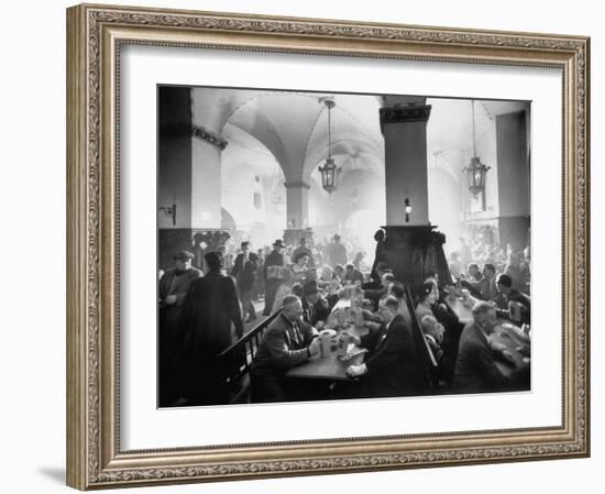 The Hofbrauhaus with Patrons Sitting at Long Tables Holding Large Steins of Beer-Ralph Crane-Framed Photographic Print