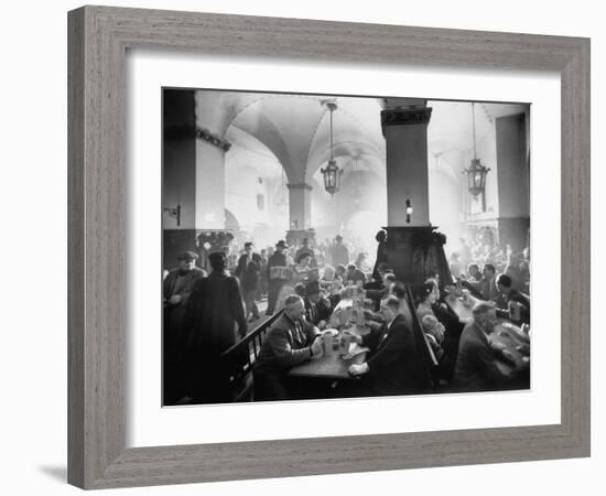 The Hofbrauhaus with Patrons Sitting at Long Tables Holding Large Steins of Beer-Ralph Crane-Framed Photographic Print