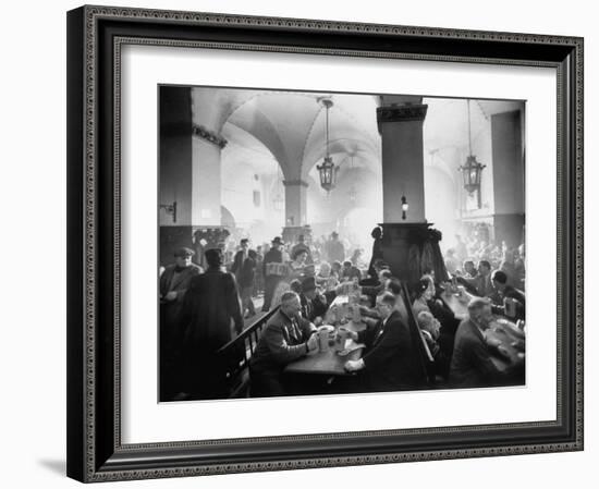 The Hofbrauhaus with Patrons Sitting at Long Tables Holding Large Steins of Beer-Ralph Crane-Framed Photographic Print