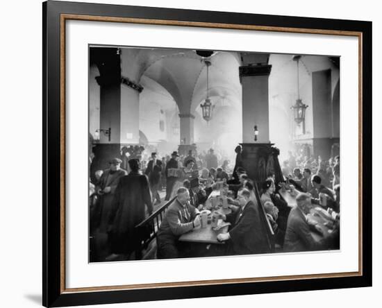 The Hofbrauhaus with Patrons Sitting at Long Tables Holding Large Steins of Beer-Ralph Crane-Framed Premium Photographic Print