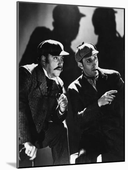 THE HOUND OF THE BASKERVILLES, 1939 directed by SIDNEY LANFIELD. Nigel Bruce and Basil Rathbone (b/-null-Mounted Photo