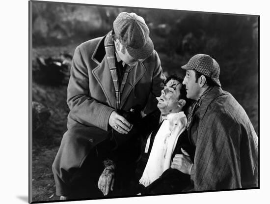 THE HOUND OF THE BASKERVILLES, 1939 directed by SIDNEY LANFIELD. Nigel Bruce, Richard Greene and Ba-null-Mounted Photo
