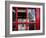 The houses of parliament reflected in an iconic red phone box in Westminster, London.-Alex Saberi-Framed Photographic Print