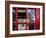 The houses of parliament reflected in an iconic red phone box in Westminster, London.-Alex Saberi-Framed Photographic Print