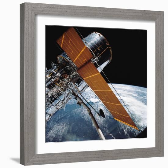 The Hubble Space Telescope Backdropped by Planet Earth-null-Framed Photographic Print