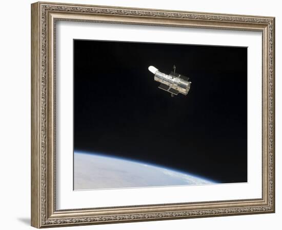 The Hubble Space Telescope in Orbit Above Earth-null-Framed Photographic Print