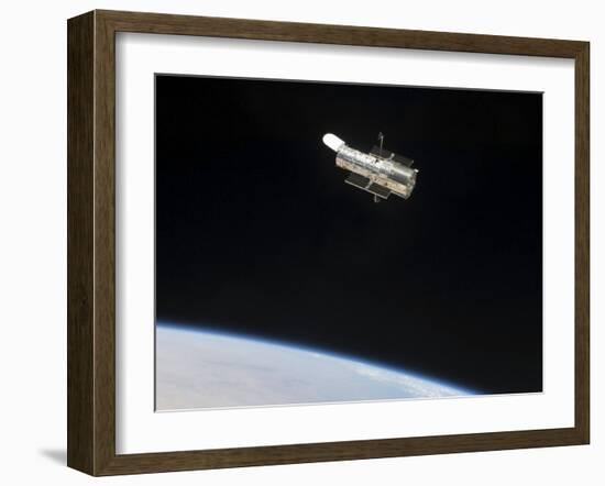 The Hubble Space Telescope in Orbit Above Earth-null-Framed Photographic Print