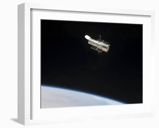 The Hubble Space Telescope in Orbit Above Earth-null-Framed Photographic Print