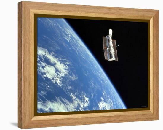 The Hubble Space Telescope with a Blue Earth in the Background-Stocktrek Images-Framed Premier Image Canvas