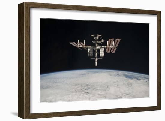 The International Space Station in Orbit Above Earth-null-Framed Photographic Print