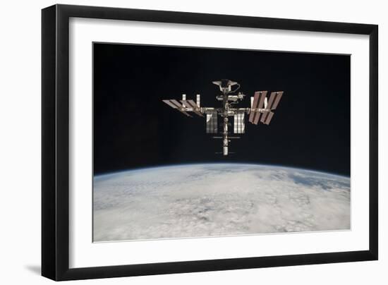 The International Space Station in Orbit Above Earth-null-Framed Photographic Print