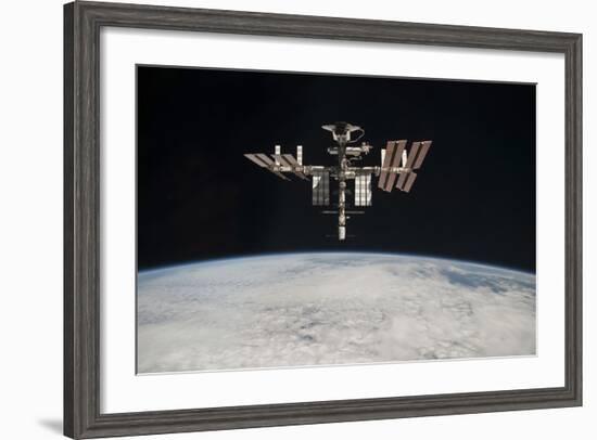 The International Space Station in Orbit Above Earth-null-Framed Photographic Print