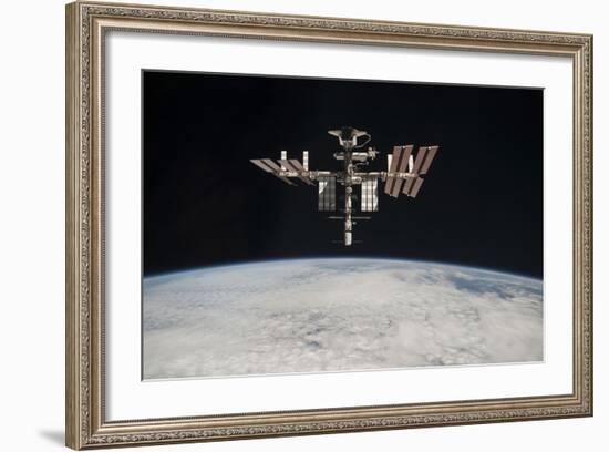 The International Space Station in Orbit Above Earth-null-Framed Photographic Print