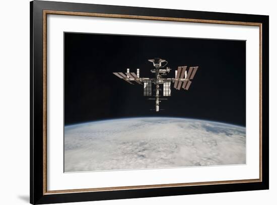 The International Space Station in Orbit Above Earth-null-Framed Photographic Print