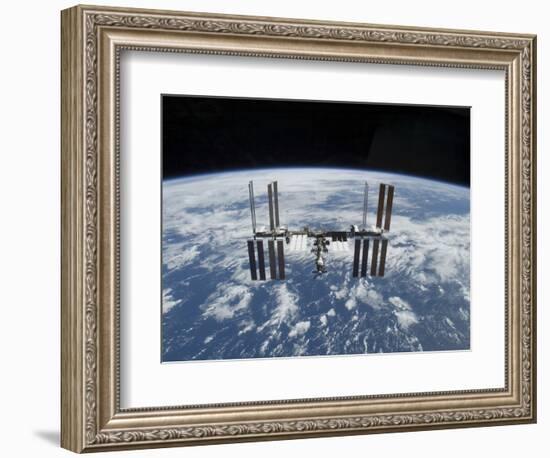 The International Space Station in Orbit Above the Earth-null-Framed Photographic Print