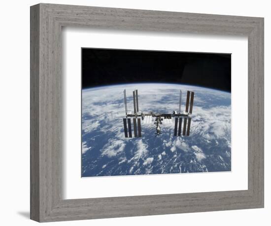 The International Space Station in Orbit Above the Earth-null-Framed Photographic Print