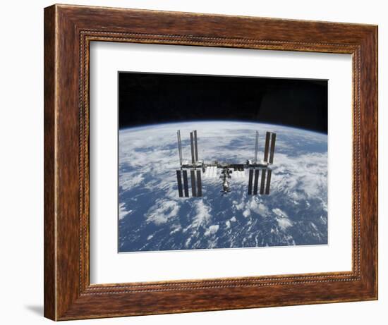 The International Space Station in Orbit Above the Earth-null-Framed Photographic Print