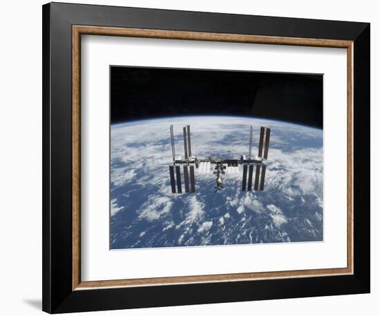 The International Space Station in Orbit Above the Earth-null-Framed Photographic Print