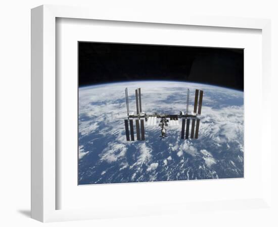 The International Space Station in Orbit Above the Earth-null-Framed Photographic Print