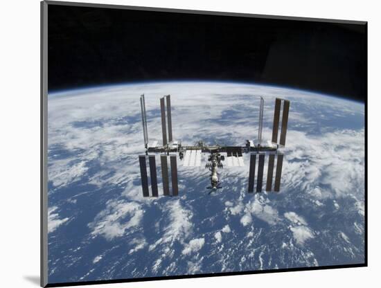 The International Space Station in Orbit Above the Earth-null-Mounted Photographic Print