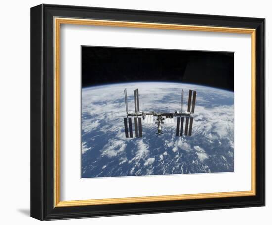 The International Space Station in Orbit Above the Earth-null-Framed Photographic Print