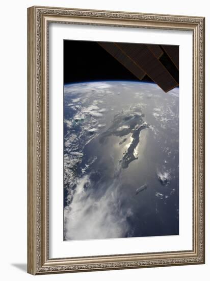 The Island of Hispaniola with Sunglint Illuminating the Peninsula of Haiti-null-Framed Photographic Print