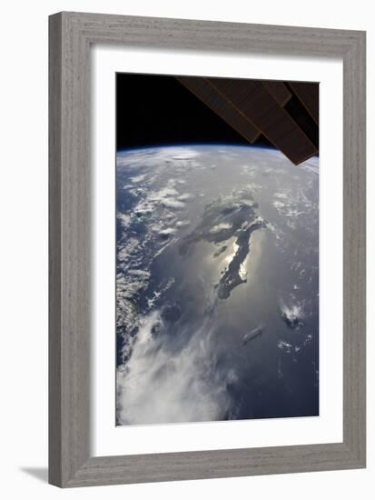 The Island of Hispaniola with Sunglint Illuminating the Peninsula of Haiti-null-Framed Photographic Print