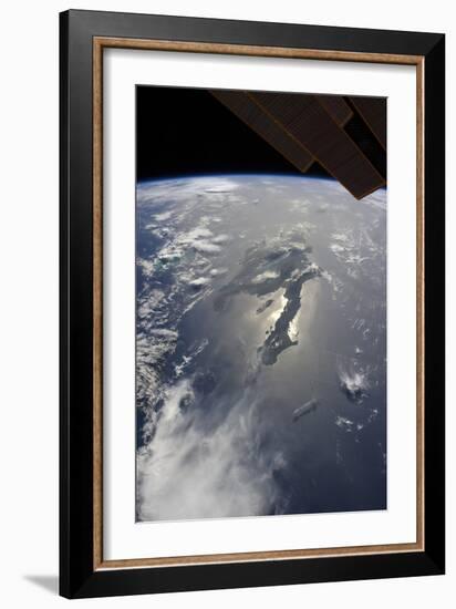 The Island of Hispaniola with Sunglint Illuminating the Peninsula of Haiti-null-Framed Photographic Print