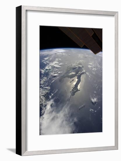 The Island of Hispaniola with Sunglint Illuminating the Peninsula of Haiti-null-Framed Photographic Print