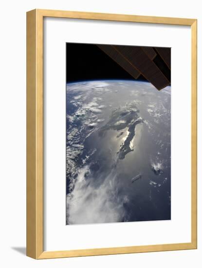 The Island of Hispaniola with Sunglint Illuminating the Peninsula of Haiti-null-Framed Photographic Print