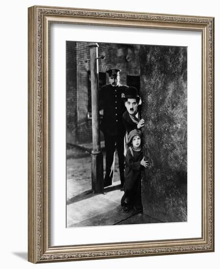 The Kid, Tom Wilson, Charles Chaplin, Jackie Coogan, 1921-null-Framed Photo