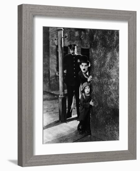 The Kid, Tom Wilson, Charles Chaplin, Jackie Coogan, 1921-null-Framed Photo