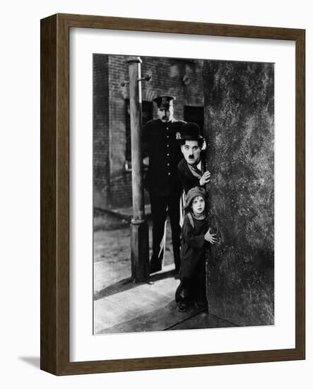 The Kid, Tom Wilson, Charles Chaplin, Jackie Coogan, 1921-null-Framed Photo