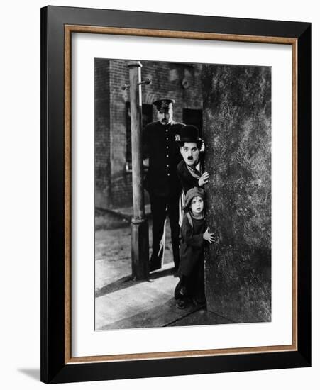 The Kid, Tom Wilson, Charles Chaplin, Jackie Coogan, 1921-null-Framed Photo